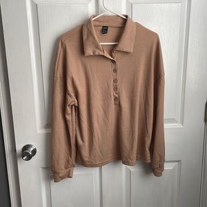 Brown polyester sweater. Size medium, never worn before.